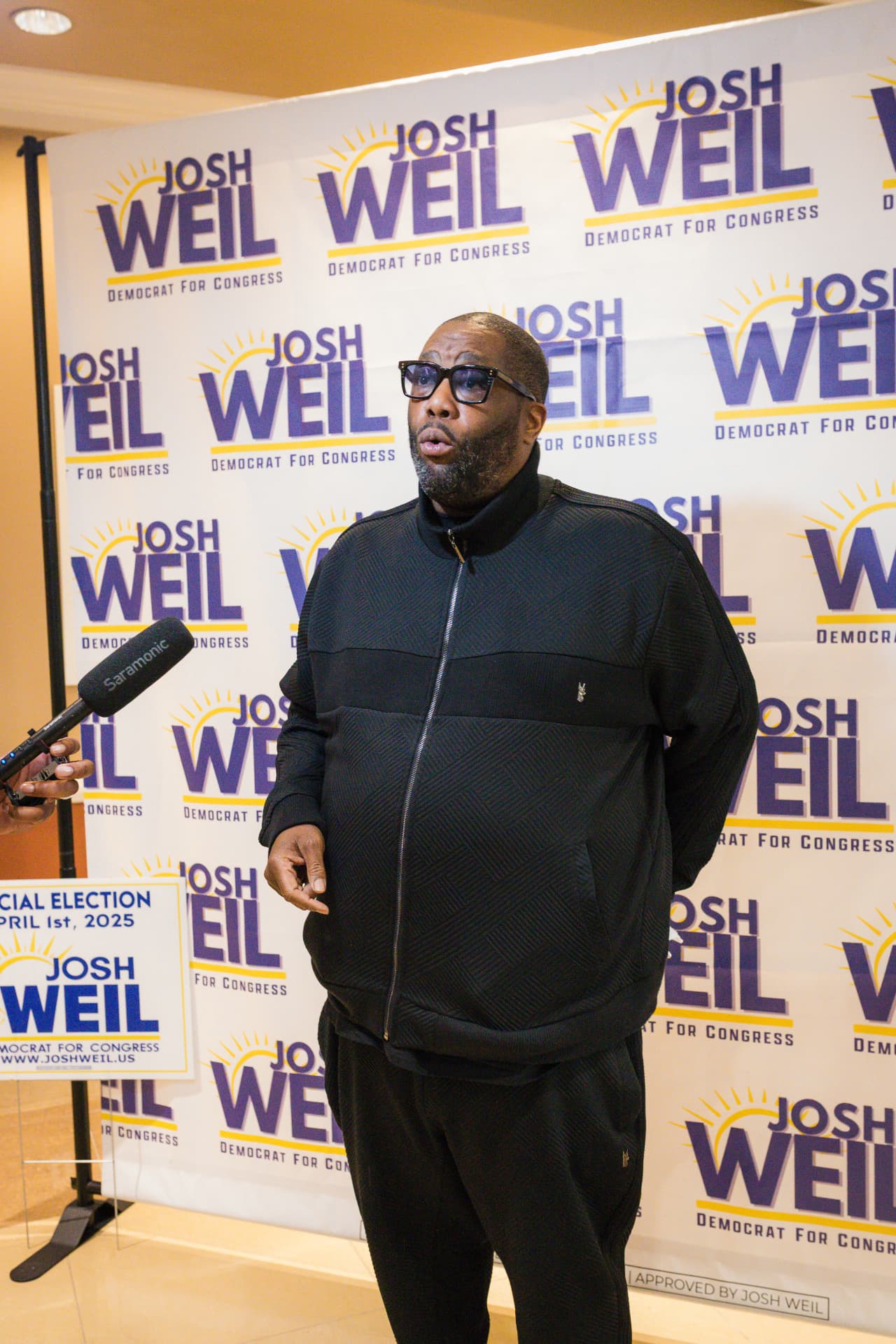 Cultural surrogate speaking to press at a campaign event
