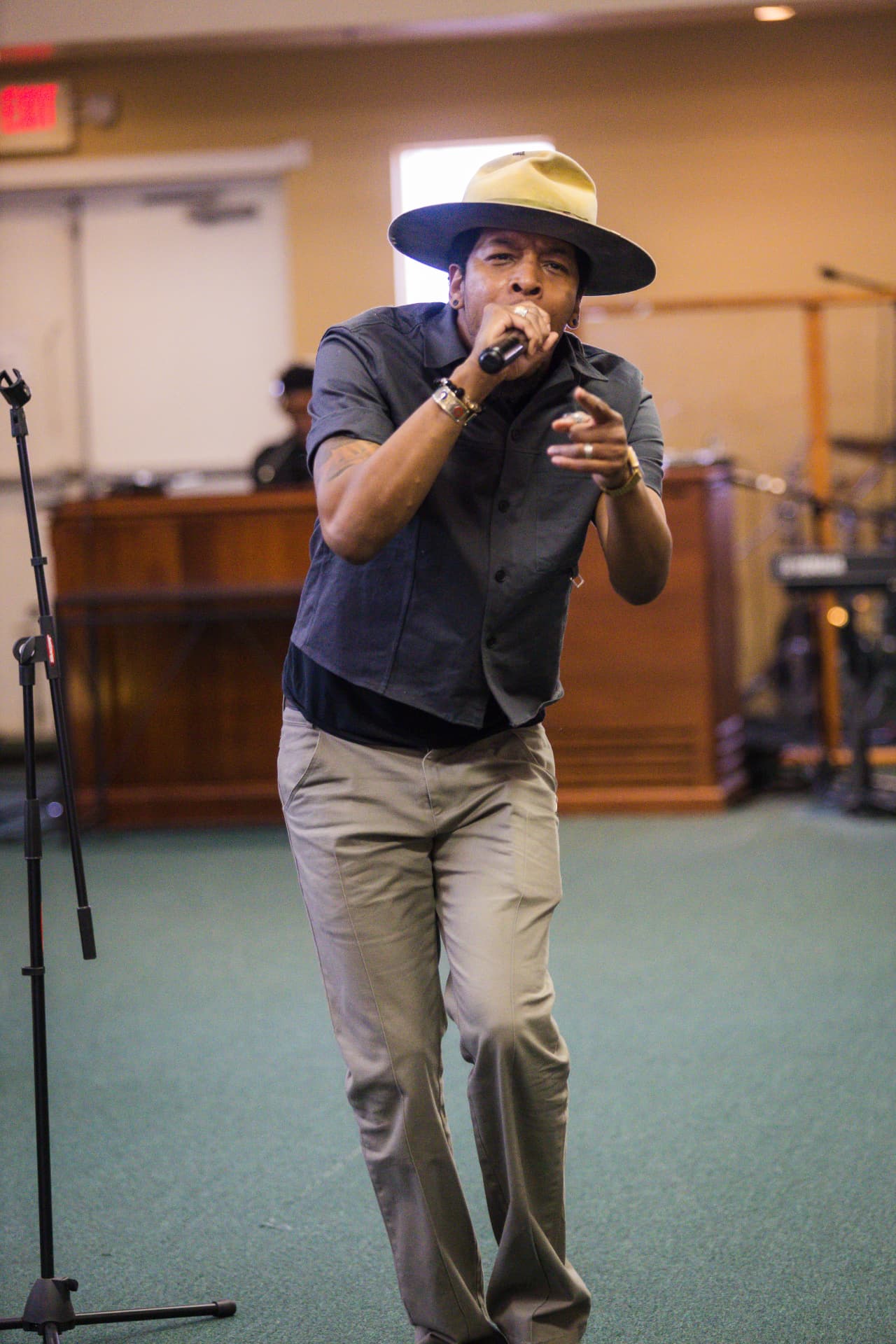 Deitrick Haddon performing during a faith-based turnout event